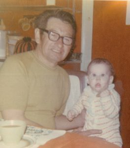 Angela as a baby sitting with her Grampie