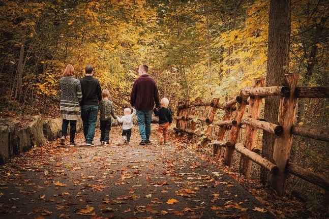 Derek Feltz's family photo in a trail in the forest